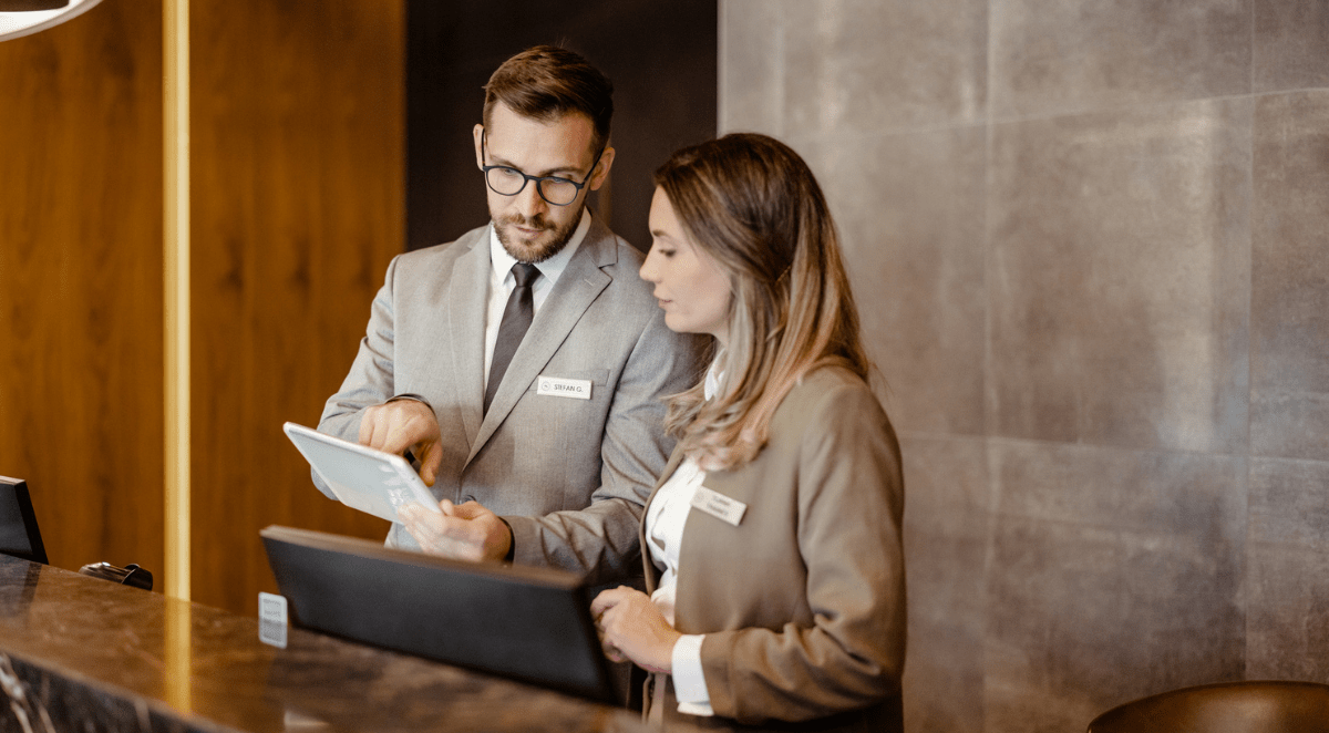 Hotel staff coordinating daily operations at the front desk